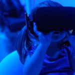 Virtual Worlds - girl using VR goggles