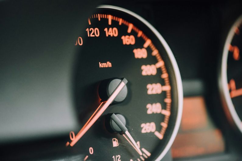 Empathetic Car - closeup photo of black analog speedometer