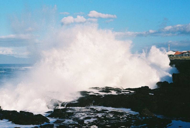 Wave Energy - a large wave crashing into a rocky shore