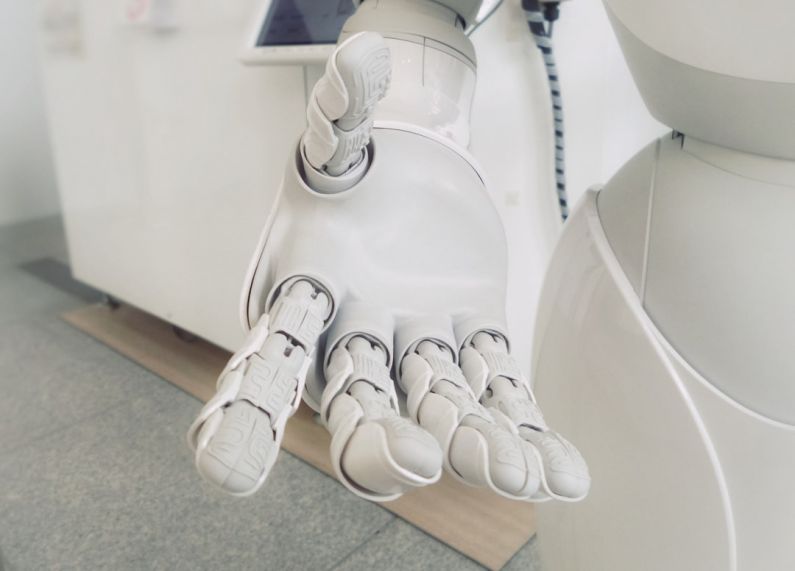 Healthcare AI - closeup photo of white robot arm