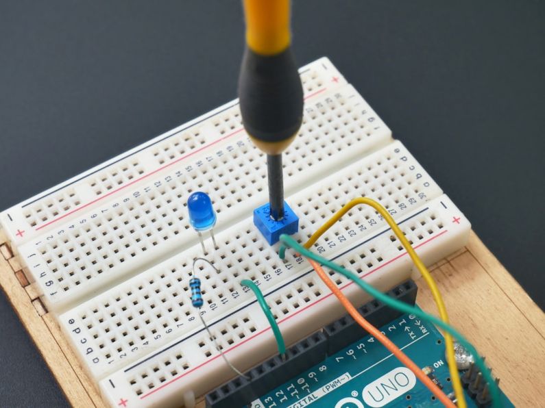 Quantum Circuit - a soldering soldering tool is attached to a bread board
